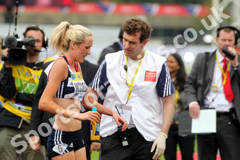 Eilish McColgan picked up an injury during the 3000 metres Steeplechase being seen to by a doctor, 2011 Aviva London Grand Prix